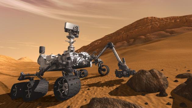 This artist concept features NASA Mars Science Laboratory Curiosity rover, a mobile robot for investigating Mars past or present ability to sustain microbial life. The rover examines a rock on Mars with a set of tools at the end of the rover arm.