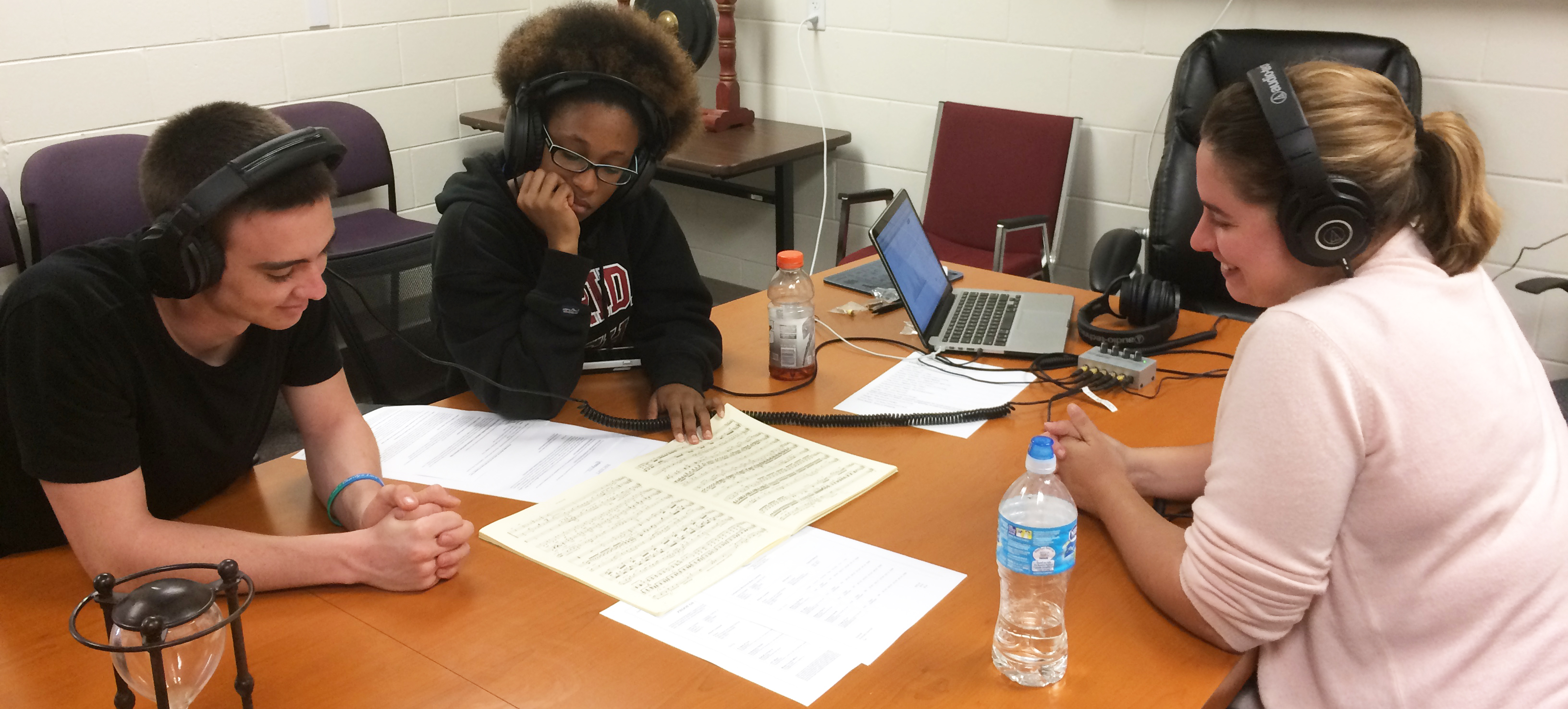 Florida Tech students Connor Mahoney and Tatjana Jemmott review audio mixes with Resident Artist Alice Lestang.
