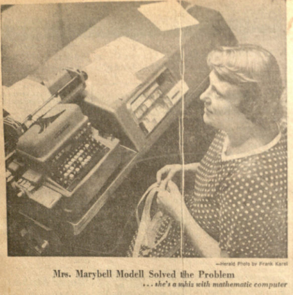Marybelle Modell (incorrectly identified as "Marybell" in caption) reading an LGP-30 tape in Brevard Engineering College's Computer Center in 1961