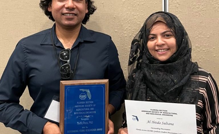 Photo of Reza, Student Recognized with Honors at Conference