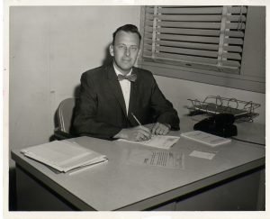 Jerry Keuper, the first president of Florida Tech, sitting at his desk.