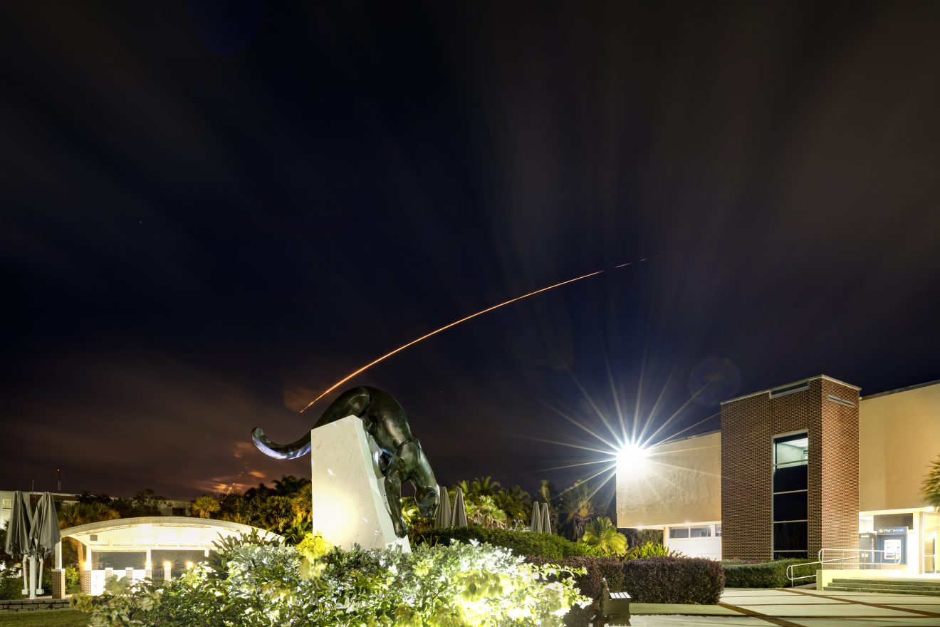 SpaceX Falcon 9 TurkSat 5A night launch over Panther statue on Jan. 7, 2021.